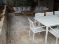 Dudley Outdoor Room With Sandstone Walls, Travertine Paving And Steps