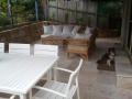 Dudley Outdoor Room With Sandstone Walls, Travertine Paving And Steps