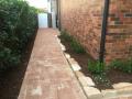 National Park Street Merewether: Paved pathways and patio areas. Sandstone garden edges. Timber steps, garden soils, Gardenias and pine bark