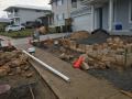 Surfside Drive Catherine Hill Bay : Excavations, sandstone walls, steps and edges. Subsoil drainage, aluminium edging, garden and lawn soils, decorative gravels, mulches and Sir Walter lawns