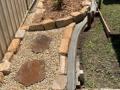 Valentine Garden. Excavatiions, sandstone edging, concrete mowing edges, organic soils, Lilly Pilly 'Cascade' hedge, woodchip mulch