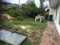 Swansea Heads Front Courtyard. Design, demolition, excavations, sandstone block walls, concrete, drainage, new steps, limestone paving and synthetic turf