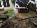 National Park Street Hamilton South. New Patio Area : Demolition and removal of concrete, new sub soil drainage system, preliminary and finished levels, travertine pavers and decorative pebbles