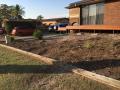 Dalrymple Street Belmont North. Preliminary Excavations / Footings / Heron Charcoal Blocks & Caps / Drainage / Sir Walter Lawns / A Variety Of Shrubs / Decorative Pebbles & Fine Pine Bark