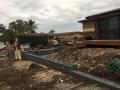 Dalrymple Street Belmont North. Preliminary Excavations / Footings / Heron Charcoal Blocks & Caps / Drainage / Sir Walter Lawns / A Variety Of Shrubs / Decorative Pebbles & Fine Pine Bark