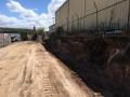 Bennett's Green Warehouse Project / Demolition And Removal Of Old Block Wall And Footings / Construction Of Concrete Sleeper And Steel Beam Retaining Wall / Including Backfill And Drainage