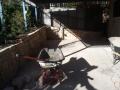 Dudley Outdoor Room With Sandstone Walls, Travertine Paving And Steps