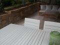 Dudley Outdoor Room With Sandstone Walls, Travertine Paving And Steps