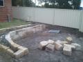 Janet St. Merewether. A Garden Patio. Excavations / Sandstone Walls & Sandstone Garden Edges / Brick Paving / Garden Soils / A Selection Of Shrubs & Pots / Mulch