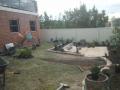 Janet St. Merewether. A Garden Patio. Excavations / Sandstone Walls & Sandstone Garden Edges / Brick Paving / Garden Soils / A Selection Of Shrubs & Pots / Mulch