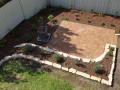 Janet St. Merewether. A Garden Patio. Excavations / Sandstone Walls & Sandstone Garden Edges / Brick Paving / Garden Soils / A Selection Of Shrubs & Pots / Mulch