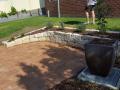 Janet St. Merewether. A Garden Patio. Excavations / Sandstone Walls & Sandstone Garden Edges / Brick Paving / Garden Soils / A Selection Of Shrubs & Pots / Mulch