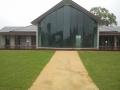 Pokolbin Wine Tasting Pavillion / Brick Garden Walls Capped With Charcoal Pavers / Sloping Sir Walter Lawns / Crushed Granite Pathways Including Crushed Granite Disabled Access Ramp